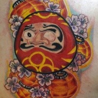 Old school style colored scapular tattoo of daruma doll with lights and flowers