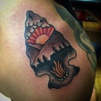Old school style colored shoulder tattoo of ancient arrow head