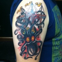 Old school style colored shoulder tattoo of octopus with sailing ship