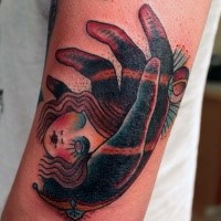 Old school style colored shoulder tattoo of hand hold dolls head