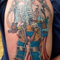 Old school style colored shoulder tattoo of lineman skeleton with lettering and flag