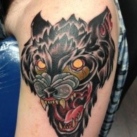 Old school style colored shoulder tattoo of evil dog head