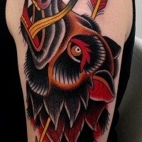 Old school style colored shoulder tattoo of boar with arrow