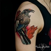 Old school style colored shoulder tattoo of big bird and leaves