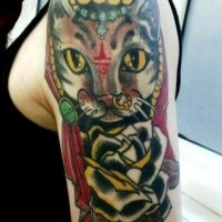 Old school style colored shoulder tattoo of cat stylized with red symbol and black rose