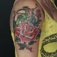 Old school style colored shoulder tattoo of Peter Pan and rose flower