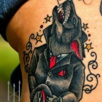 Old school style colored thigh tattoo of colored wolf in suit