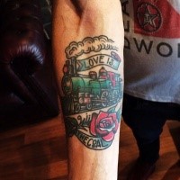 Old school style colored train with red rose and inscript forearm tattoo