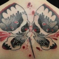 Old school style colored upper back tattoo of butterfly shaped human skulls