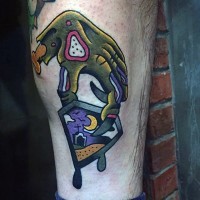Old school style colored zombie hand with little card tattoo on leg muscle