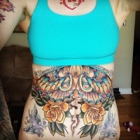 Old school style large colored butterfly with flowers tattoo on belly