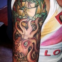 Old school style multicolored octopus with ship tattoo on sleeve