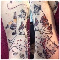 Estilo old school pintado por horitomo Manmon cats tattoo no braço