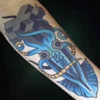 Old school style painted colored little squid tattoo on arm