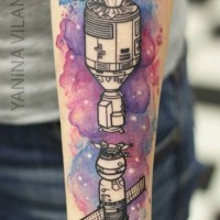Old school style painted colored space ships tattoo on arm