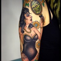 Old school style painted colored woman with mirror and flowers tattoo on shoulder