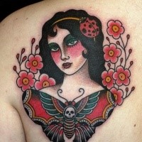 Old school style scapular tattoo of woman with flowers and butterfly