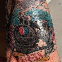 Old school style small feet tattoo of train and lettering