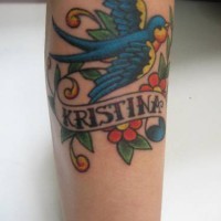 Old school tattoo with bird and name inscription