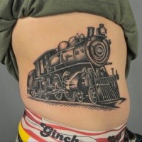 Old school type black ink side tattoo of running train