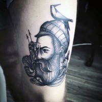 Old school vintage black and white sailor with bird portrait tattoo on thigh
