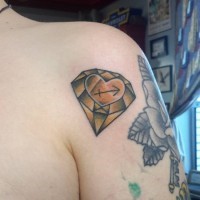 Old school yellow diamond with heart and Sagittarius symbol colored shoulder tattoo
