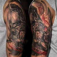 Old style black and white angry Spartan warrior tattoo on upper arm