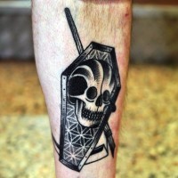 Old style black and white coffin stylized with skull and scythe leg tattoo