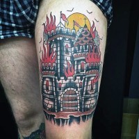 Old style colored detailed castle on fire massive thigh tattoo
