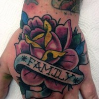 Old style colored rose with lettering family on banner hand tattoo