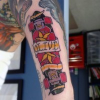 Old style colored skateboard with lettering on banner arm tattoo