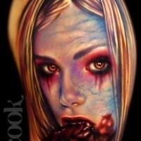 Old style creepy designed and colored bloody vampire girl tattoo on shoulder