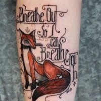 Old style designed and painted little colored fox with lettering tattoo on arm