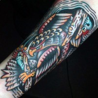Old style multicolored arm tattoo of eagle with broken bones