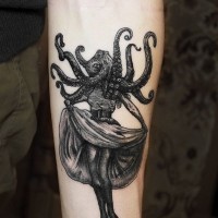 Old style pin up girl with octopus on head arm tattoo