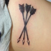 Old tribal indian arrow tattoo on girls body