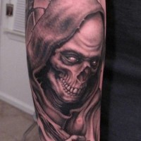 Ominous grim reaper forearm tattoo