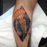 Orange jellyfish tattoo on leg