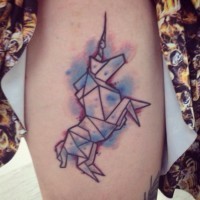 Origami unicorn with colorful paint drips tattoo in geometrical style