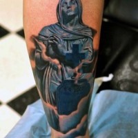 Original colored little foggy cemetery with old statue tattoo on leg
