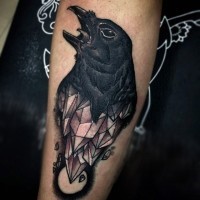 Original combined black ink crow with crystal tattoo on arm