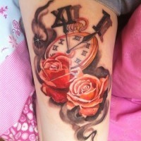 Original combined colored old clock with flowers tattoo on thigh