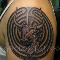 Original design Taurus in circle shaped special symbol detailed upper arm tattoo