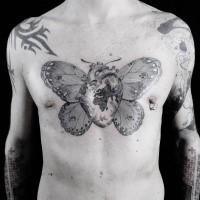 Original designed black ink chest tattoo of human heart with butterfly wings