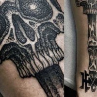 Original designed bones like ancient key with skull tattoo on arm