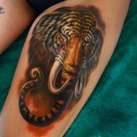 Original designed realistic looking thigh tattoo of half elephant half tiger creature
