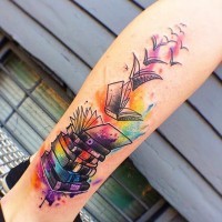 Original fantasy style multicolored flying books tattoo on leg