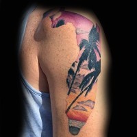 Original shaped and colored tattoo with palm trees on shoulder length