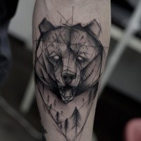 Original sketch style black ink bear head tattoo on forearm with forest