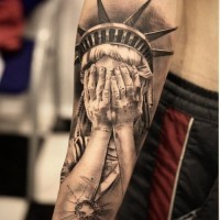 Original styled very realistic Statue of Liberty tattoo on arm